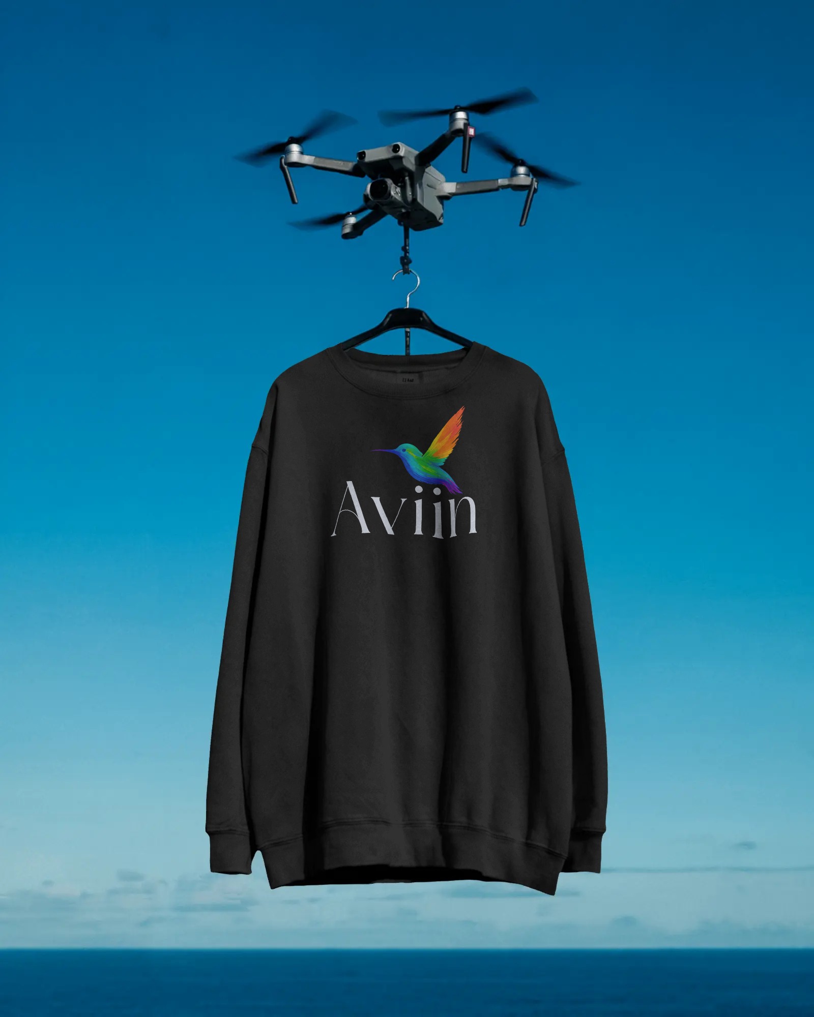 drone-hanging-sweatshirt-mockup-floating-in-blue-sky-over-ocean-modern-surreal-style-0360