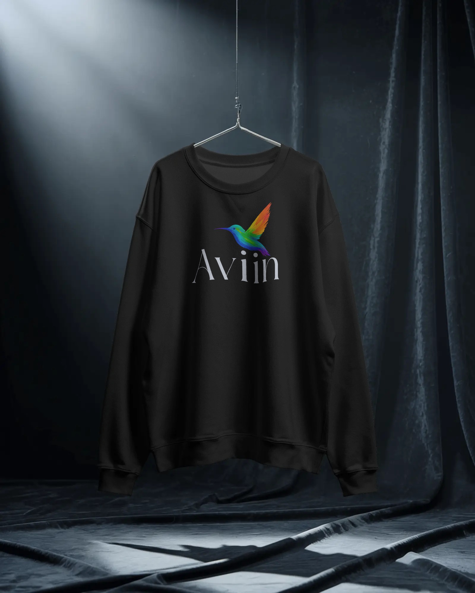 hanging-sweatshirt-mockup-on-hanger-in-moody-studio-light-with-dark-curtains-dramatic-style-0354